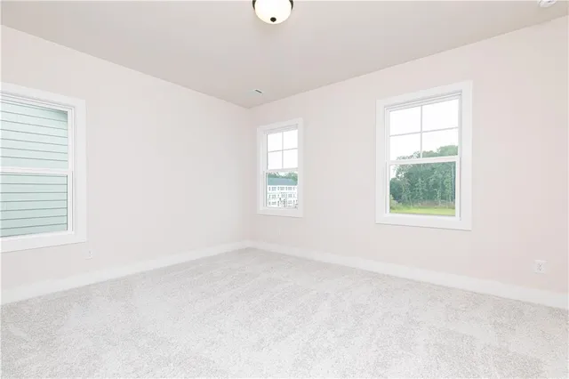 a front view of a house with swimming pool having outdoor seating