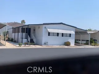 3700 Buchanan Street, Unit 164 Riverside, CA 92503 - Photo 39 of 40 a front view of a house with a road