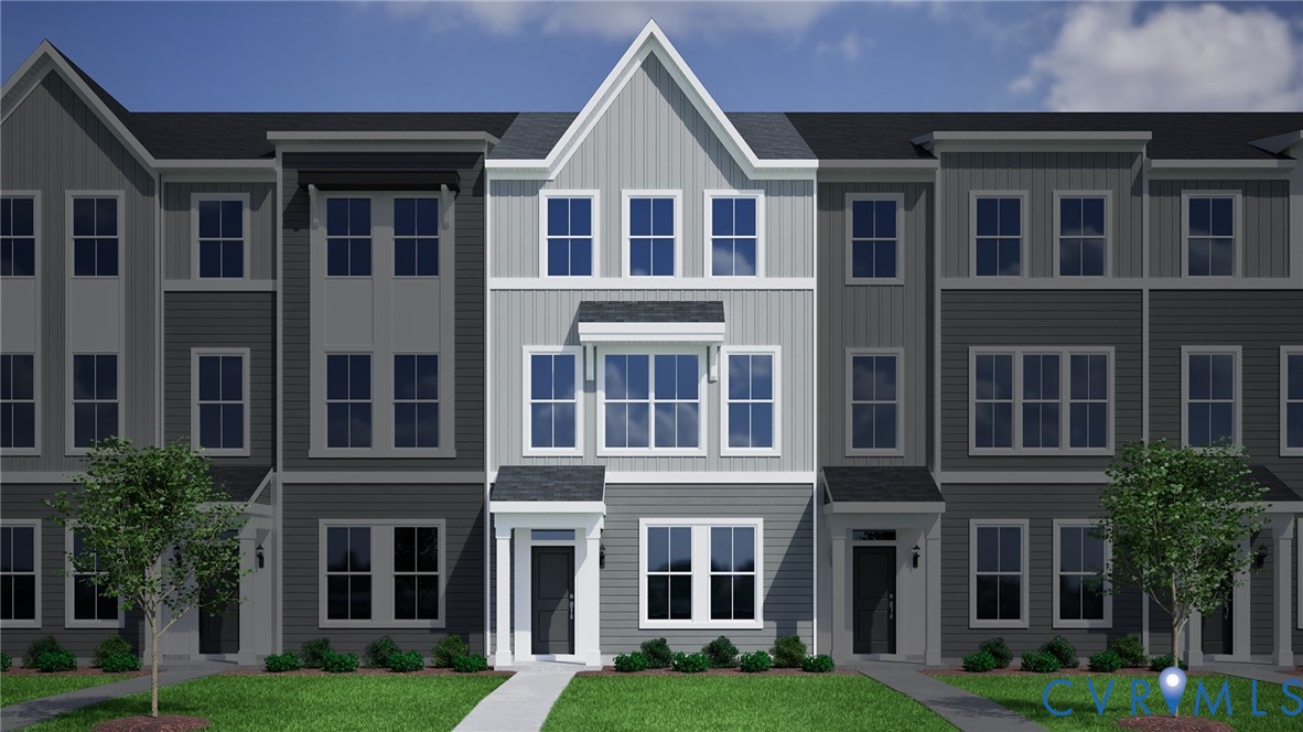 a view of a brick building next to a yard