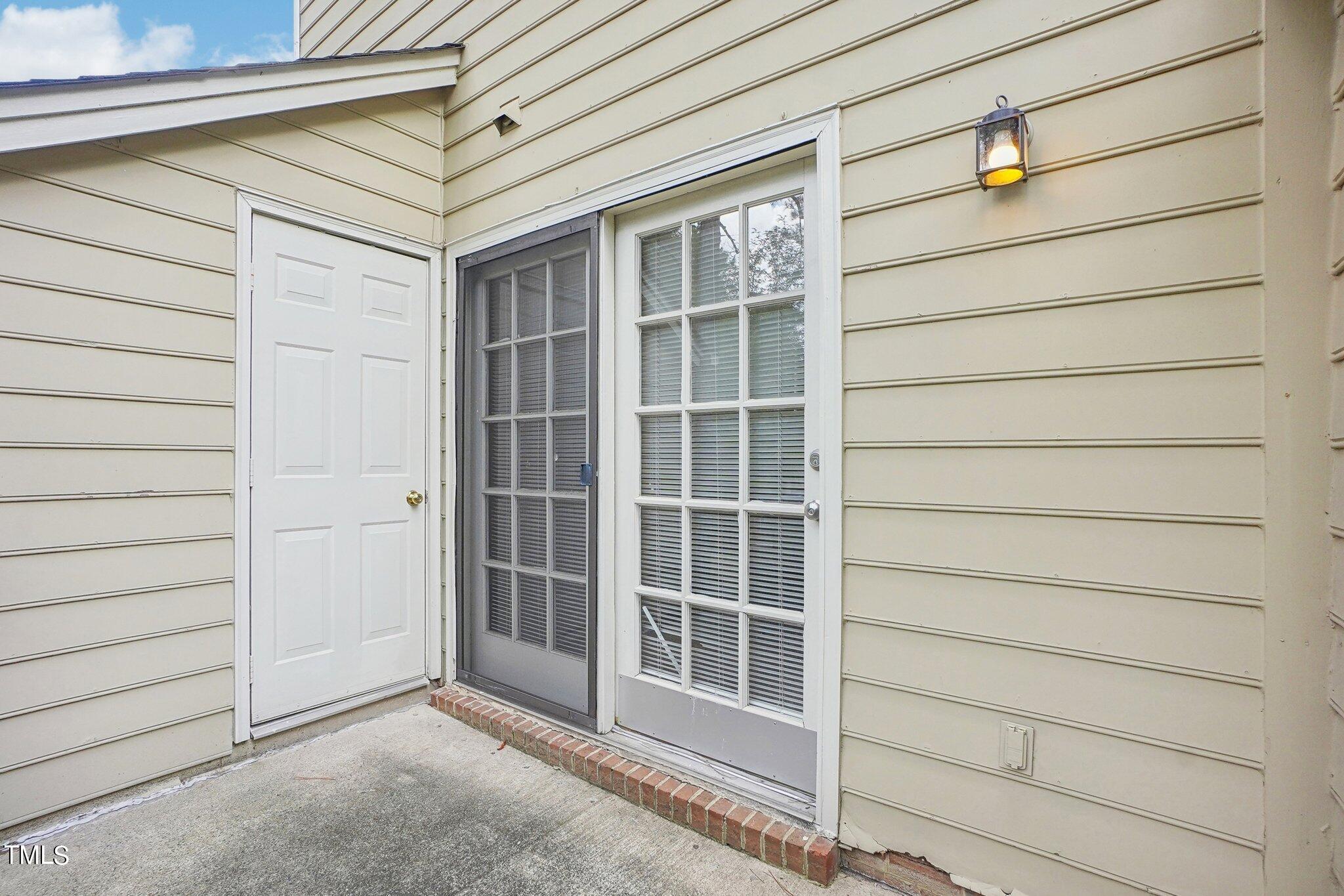902 Gatehouse Lane Durham, NC 27707 - Photo 16 of 17 a view of a house with a door