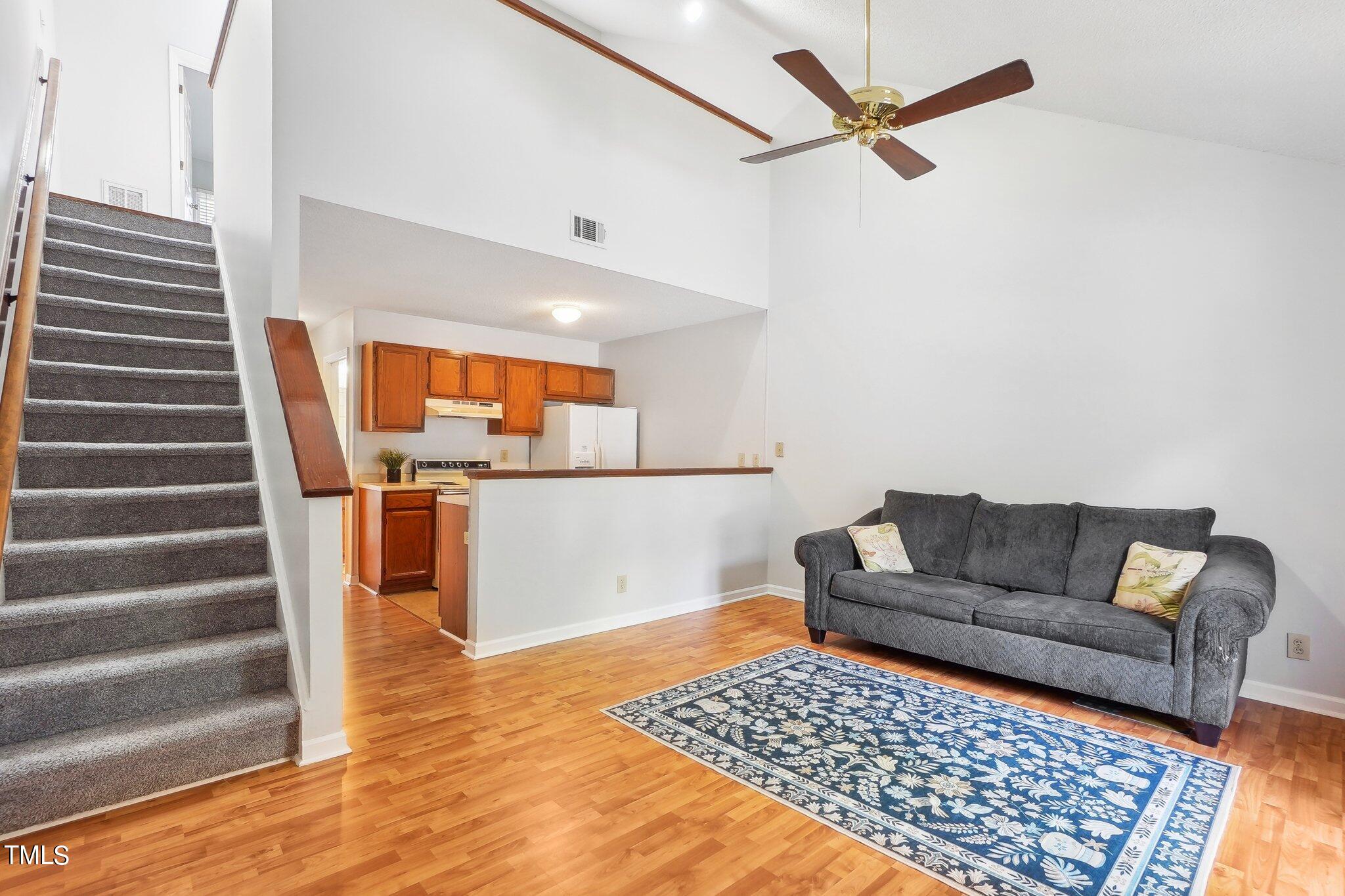 902 Gatehouse Lane Durham, NC 27707 - Photo 3 of 17 a living room with furniture and a rug