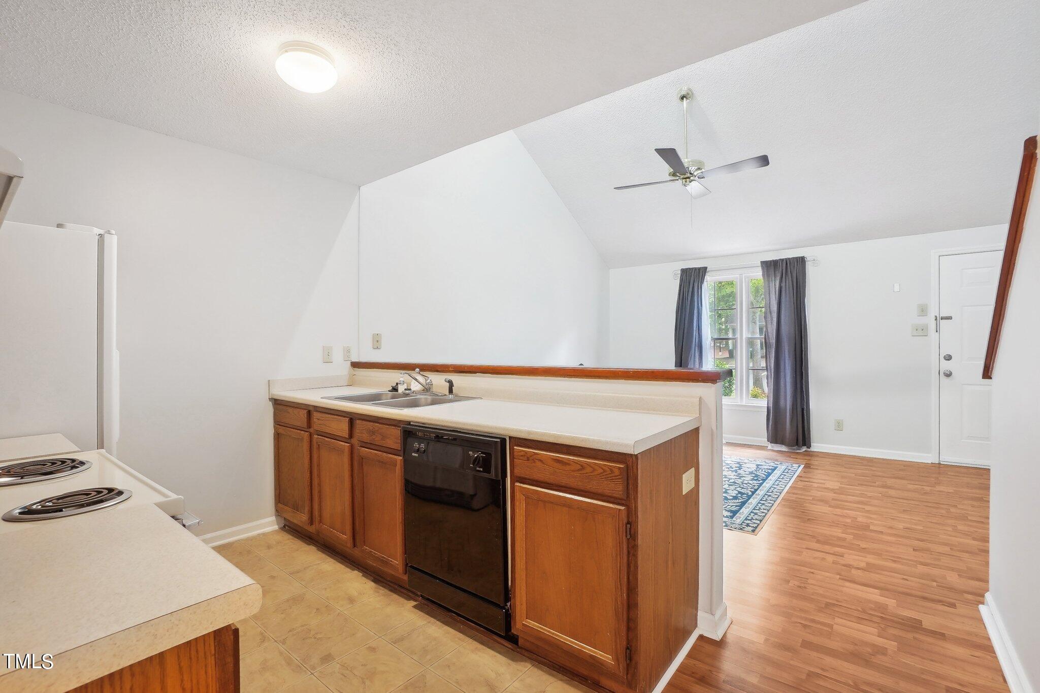 902 Gatehouse Lane Durham, NC 27707 - Photo 6 of 17 a kitchen with a stove and a refrigerator