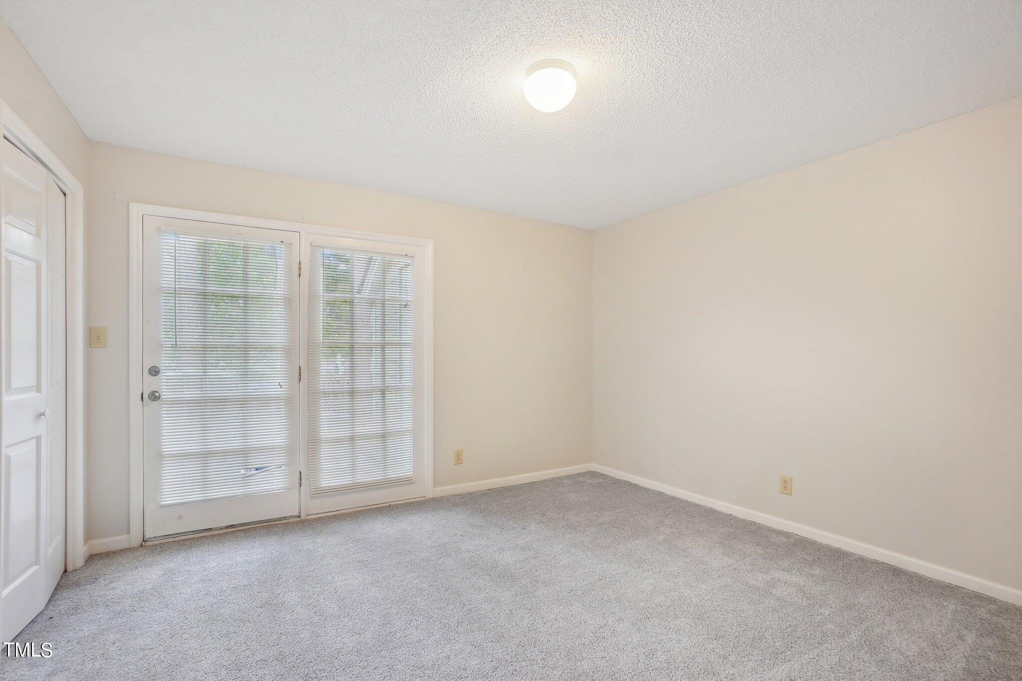902 Gatehouse Lane Durham, NC 27707 - Photo 7 of 17 an empty room with a empty space