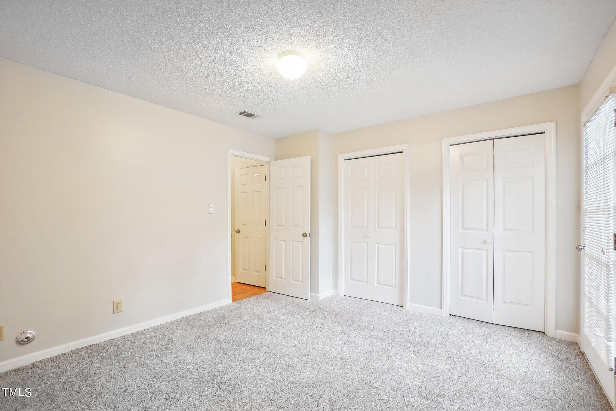 902 Gatehouse Lane Durham, NC 27707 - Photo 8 of 17 a view of an empty room