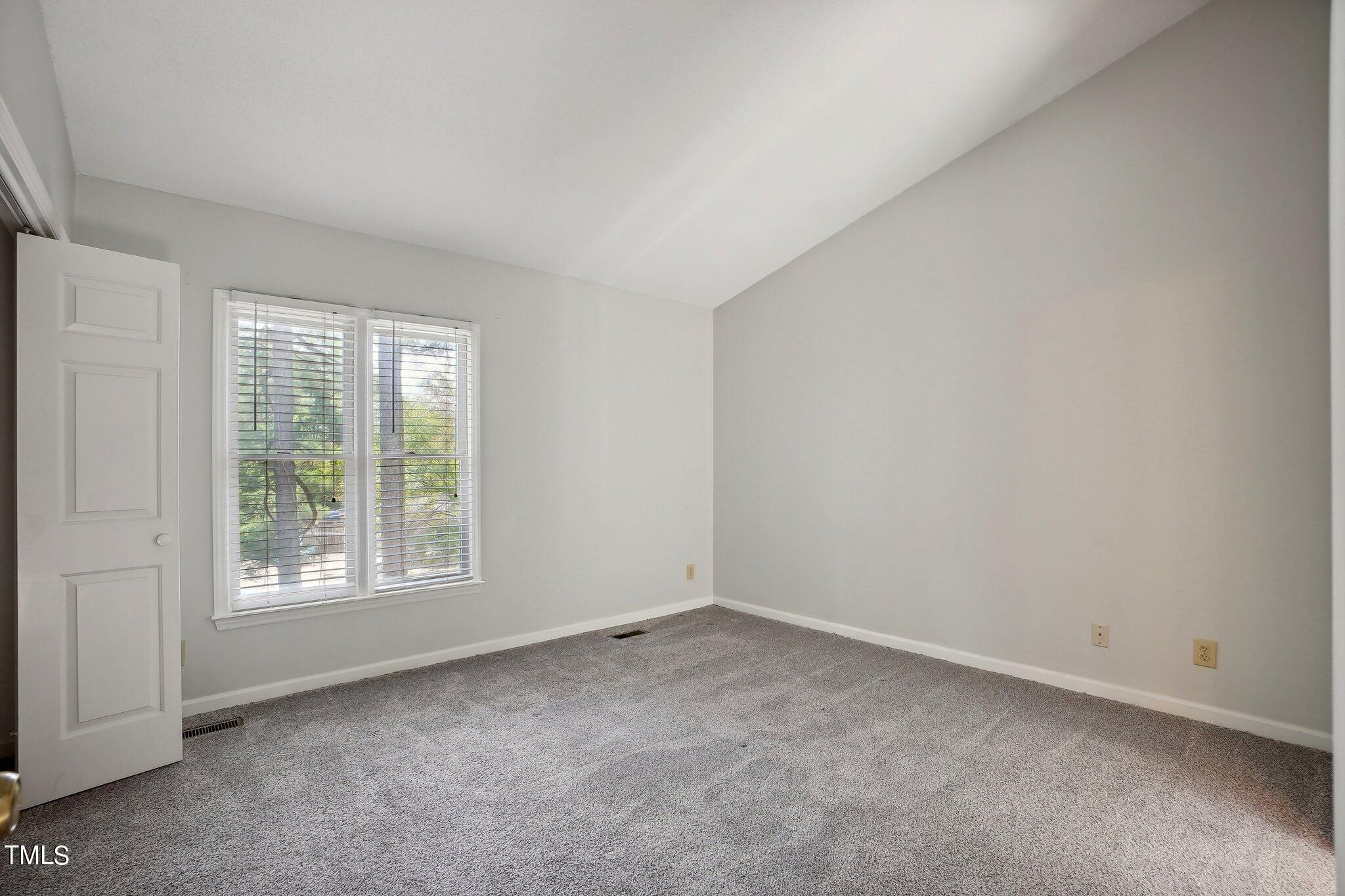 902 Gatehouse Lane Durham, NC 27707 - Photo 9 of 17 an empty room with windows