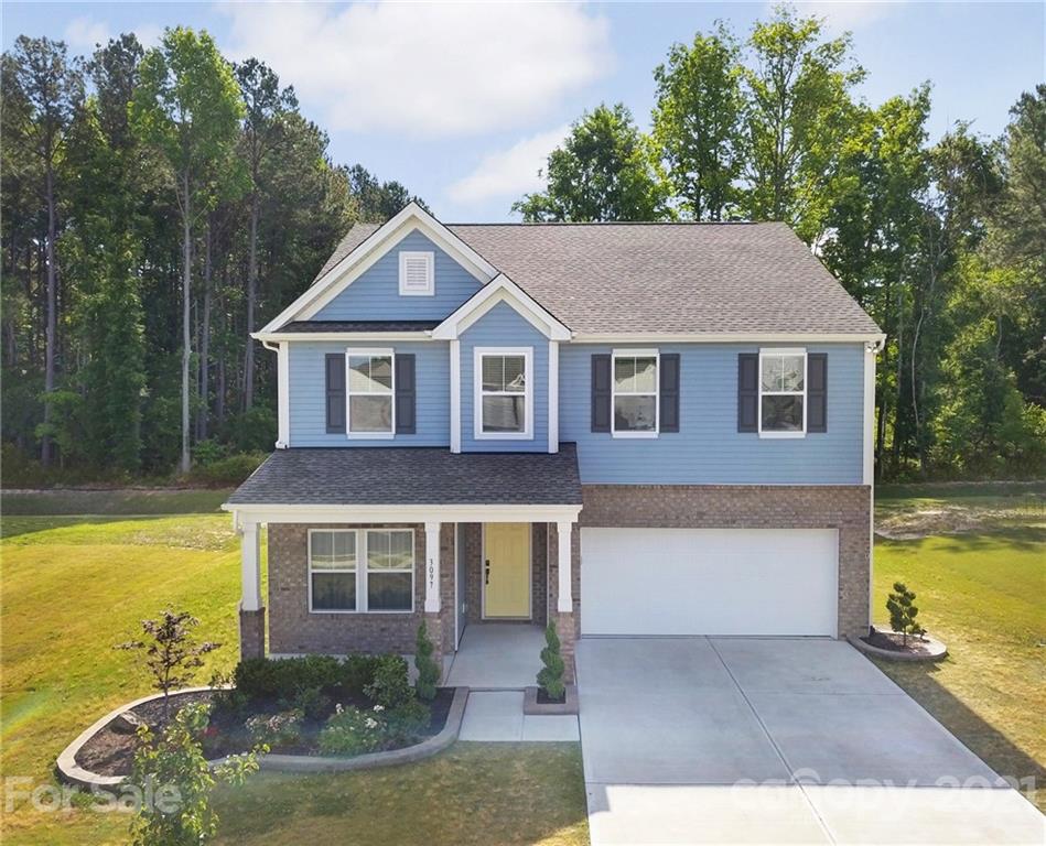 3097 Riker Street Clover, SC 29710 - Photo 1 of 39 a front view of a house with a yard