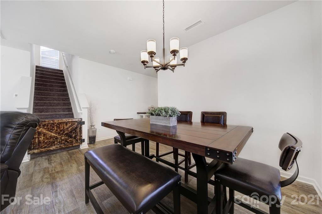 3097 Riker Street Clover, SC 29710 - Photo 11 of 39 a view of a dining room with furniture and wooden floor