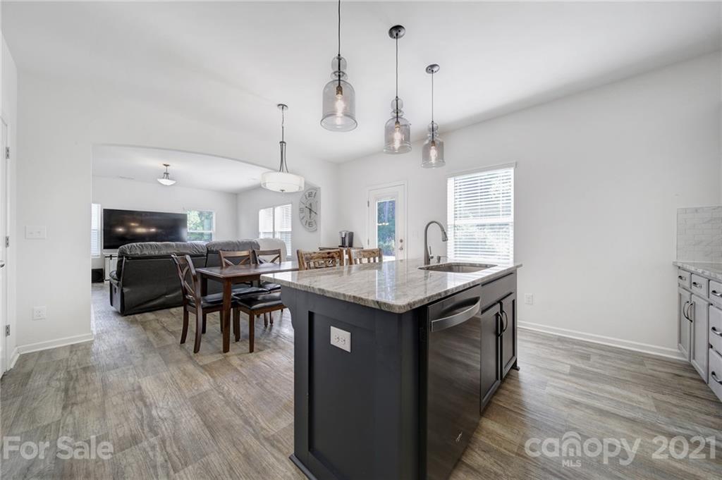 3097 Riker Street Clover, SC 29710 - Photo 20 of 39 a kitchen with a table and chairs in it