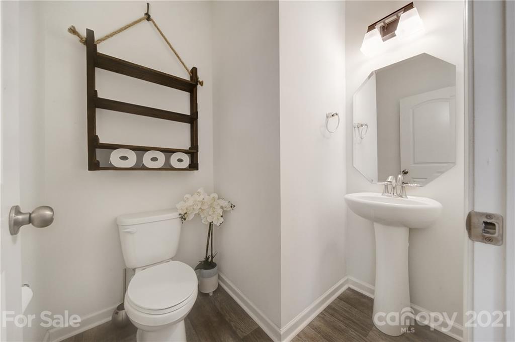 3097 Riker Street Clover, SC 29710 - Photo 23 of 39 a bathroom with a toilet sink and mirror