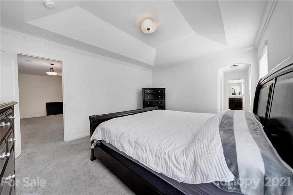 3097 Riker Street Clover, SC 29710 - Photo 24 of 39 a bedroom with a bed and mirror