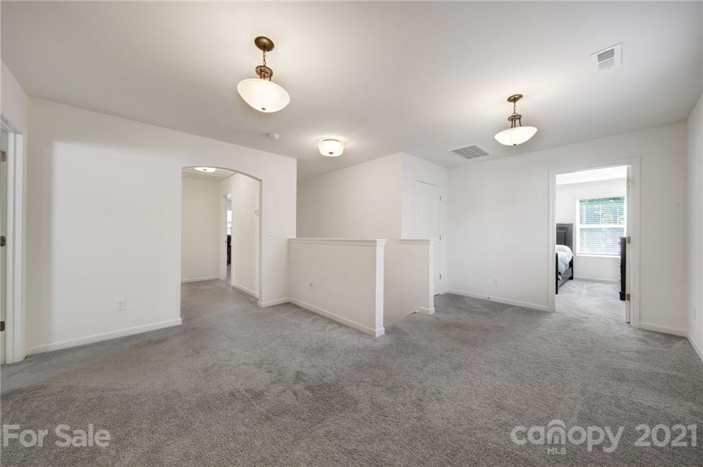3097 Riker Street Clover, SC 29710 - Photo 27 of 39 wooden floor in an empty room with a window