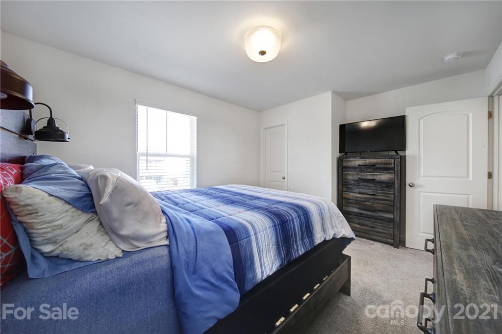 3097 Riker Street Clover, SC 29710 - Photo 29 of 39 a bedroom with a bed and a television
