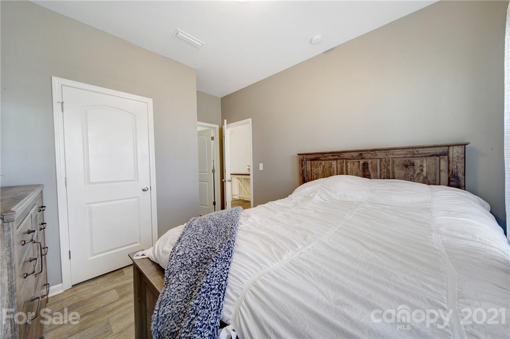 3097 Riker Street Clover, SC 29710 - Photo 7 of 39 a bedroom with a bed and wooden floor