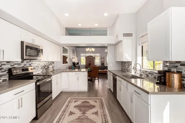 a kitchen with lots of counter top space and a sink