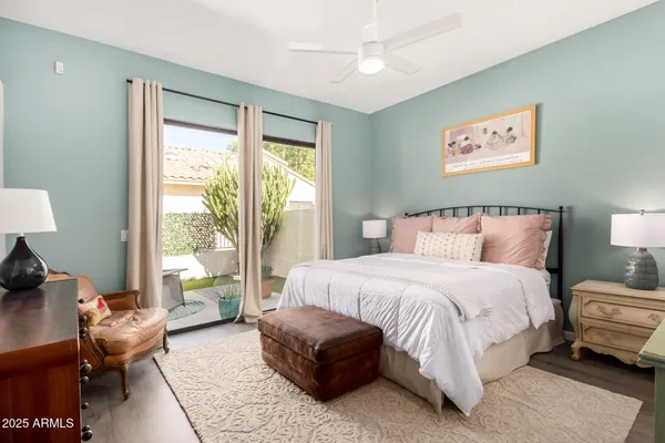 a bedroom with a bed and a couch