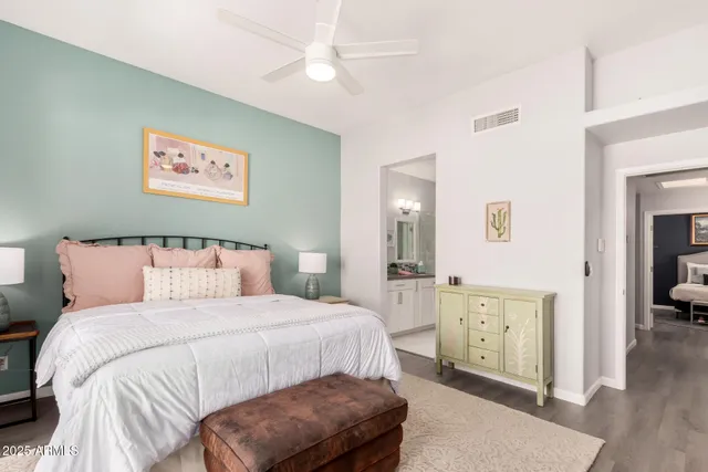 a bedroom with a bed and a view of bathroom
