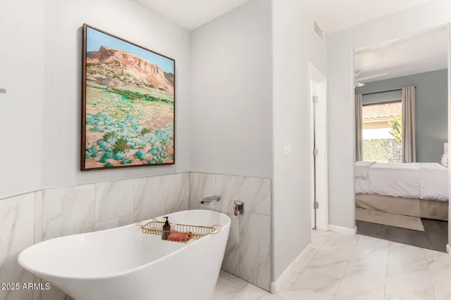 a bathroom with a bathtub and window