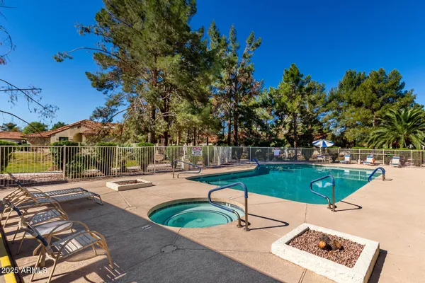 a view of a swimming pool with a patio