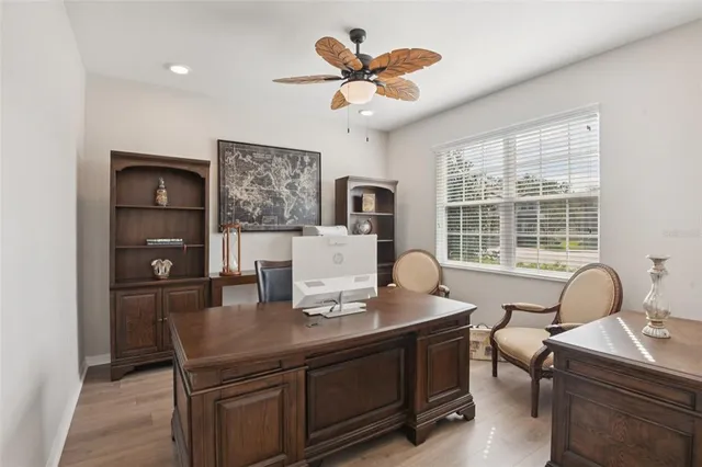 a dining room with furniture and window