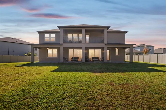 a house view with swimming pool in front of it