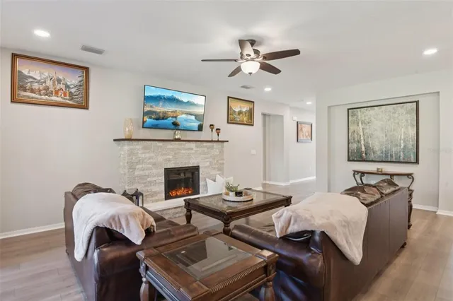 a living room with furniture and a fireplace