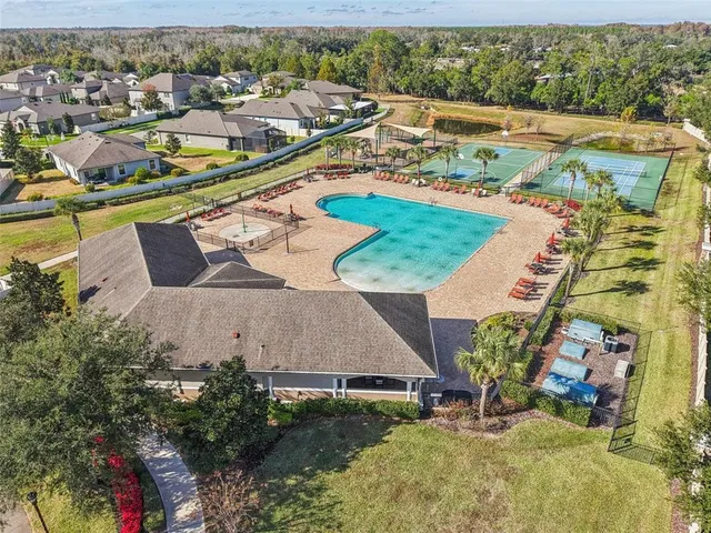 an aerial view of residential houses with outdoor space