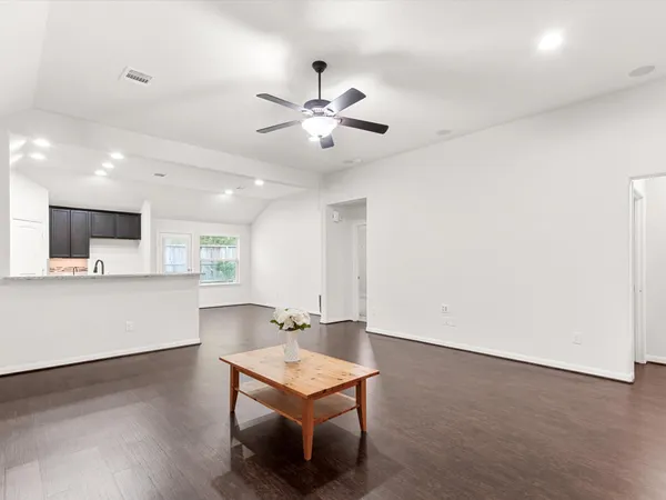 a view of kitchen with a sink a refrigerator and a stove top oven
