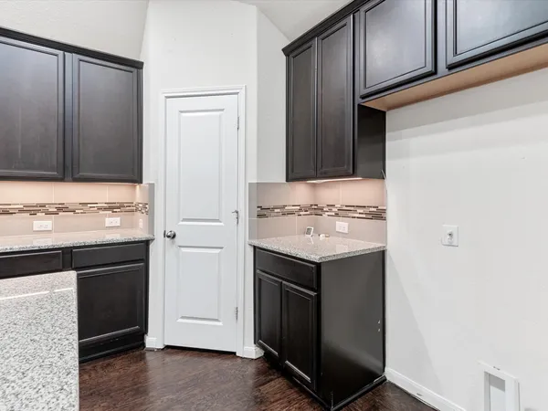 a view of cabinets with kitchen island