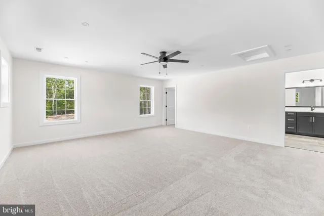 a view of empty room with windows