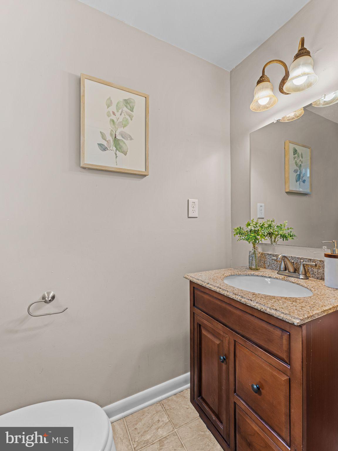 28 Dunham Loop Berlin, NJ 08009 - Photo 27 of 45 a bathroom with a granite countertop toilet sink and mirror