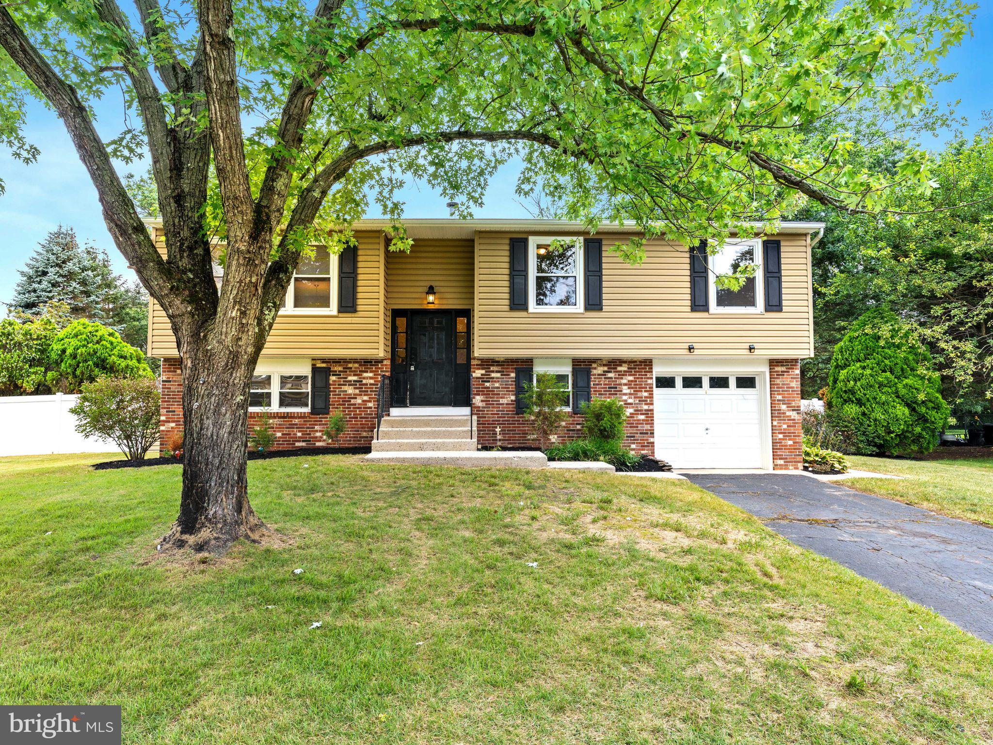 28 Dunham Loop Berlin, NJ 08009 - Photo 3 of 45 a view of a house with a tree and a yard