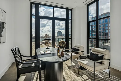 a dining room with furniture and window