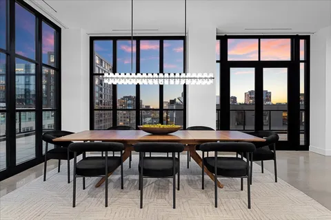 a view of a dining room with furniture window and wooden floor