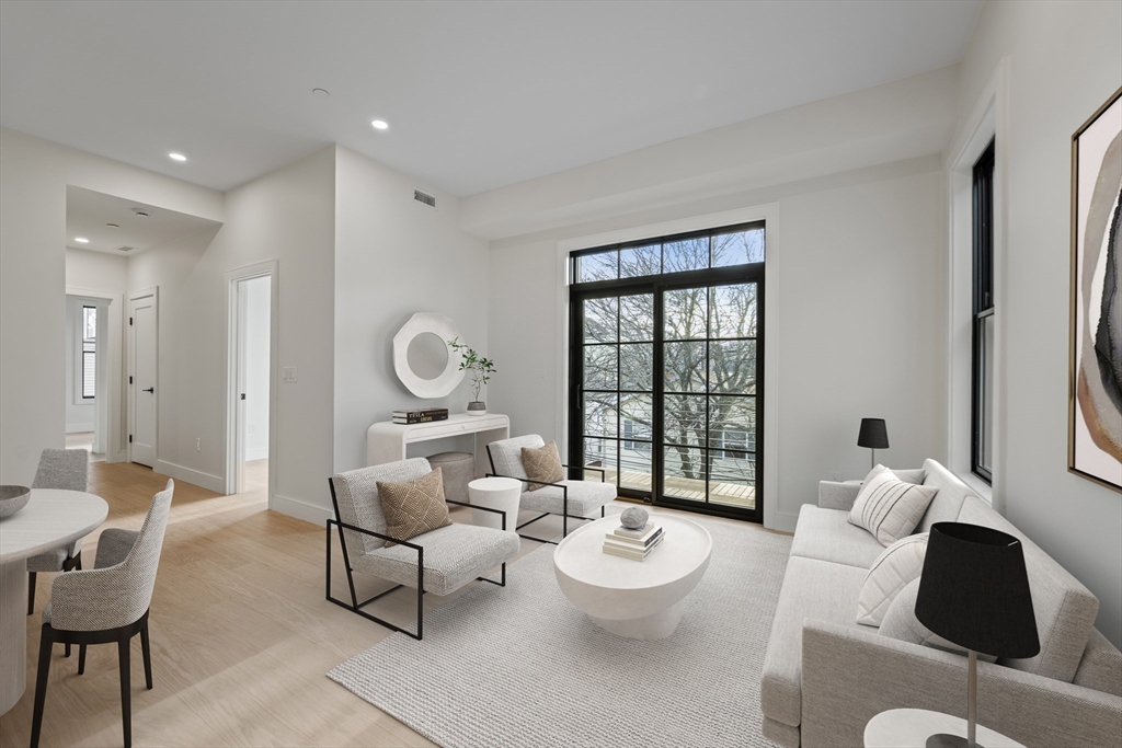 224 West 9th Street, Unit 4 Boston, MA 02127 - Photo 1 of 22 a living room with furniture and a window