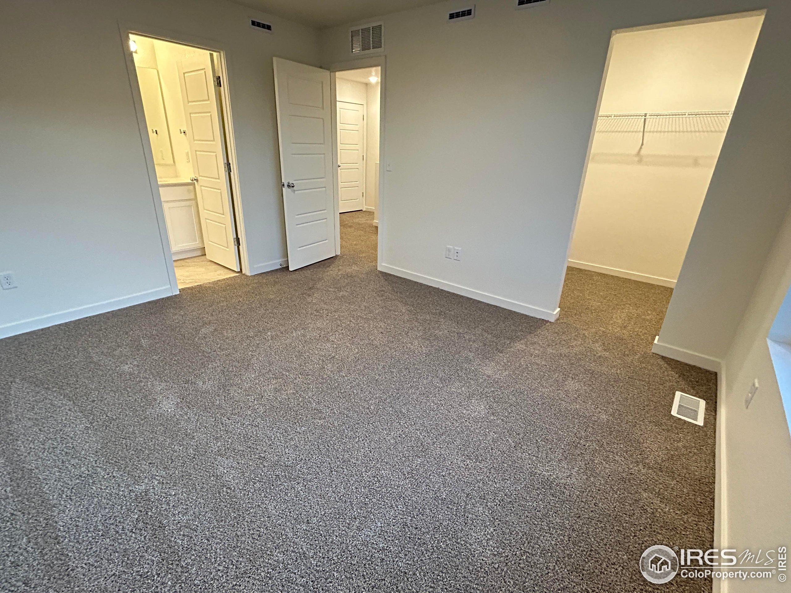 3905 Net Street Evans, CO 80620 - Photo 6 of 15 an empty room with windows