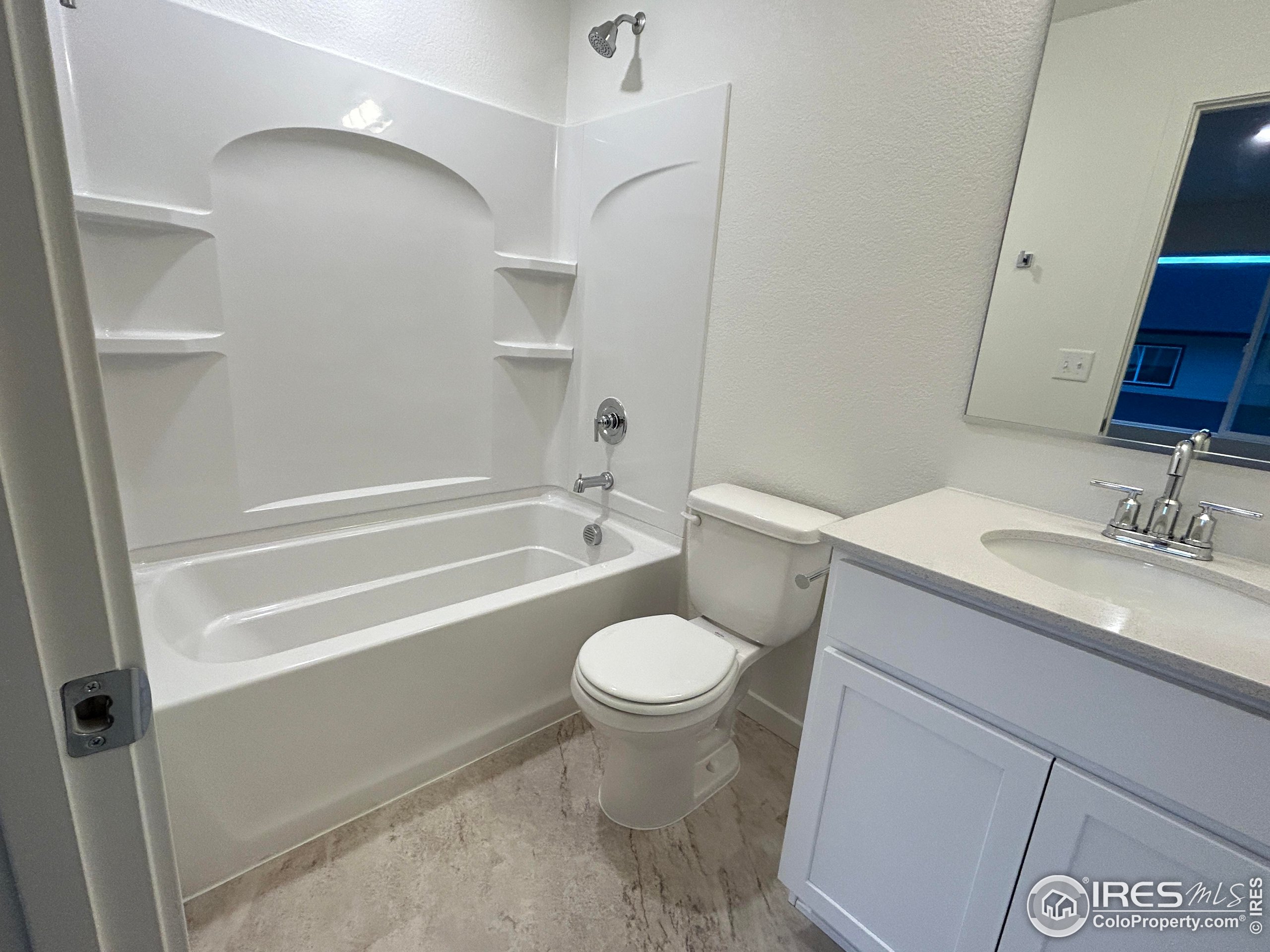 3905 Net Street Evans, CO 80620 - Photo 9 of 15 a bathroom with a sink toilet and shower