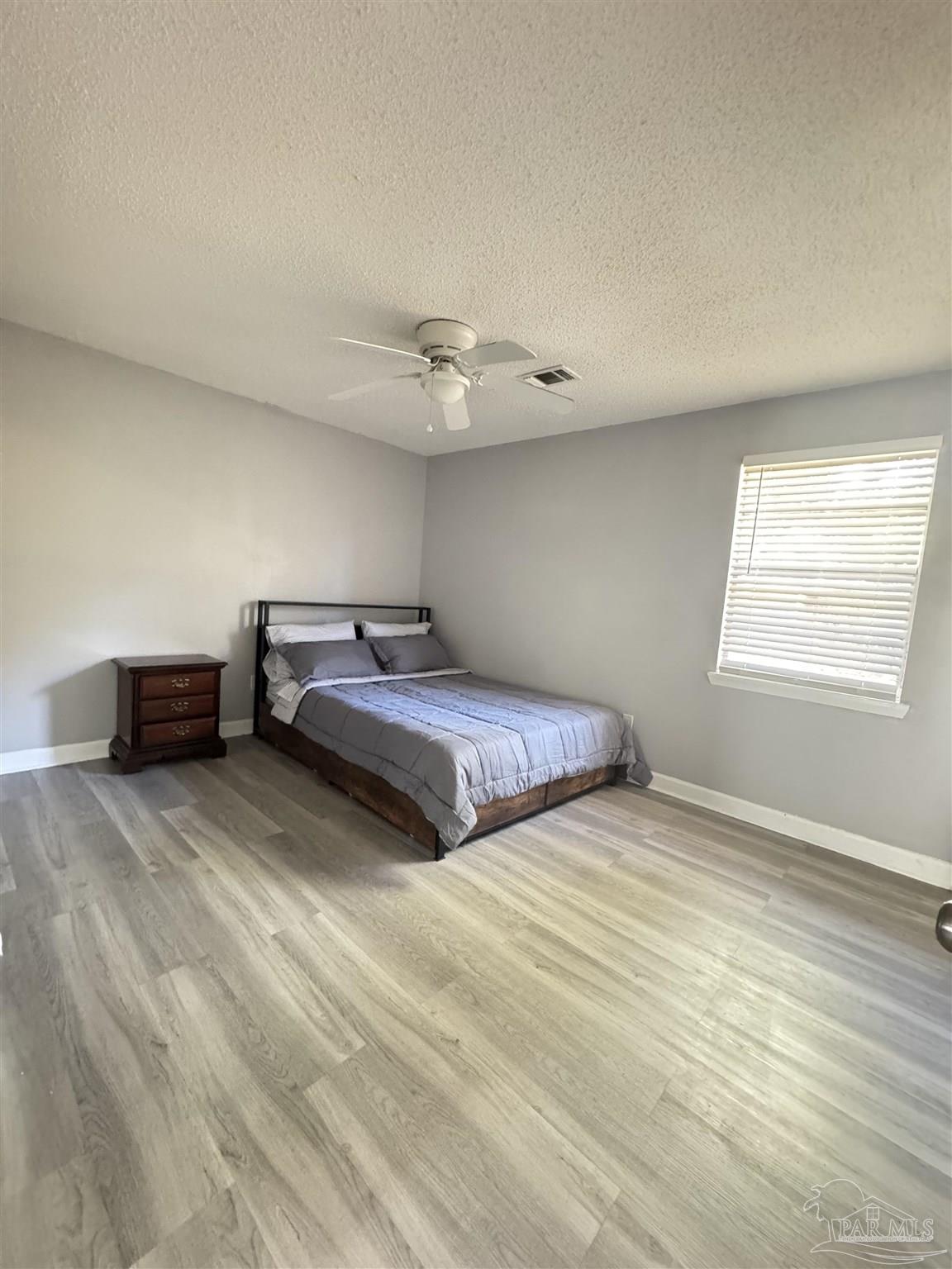 346 Quigley Road Pensacola, FL 32506 - Photo 17 of 28 a bedroom with a bed and a window