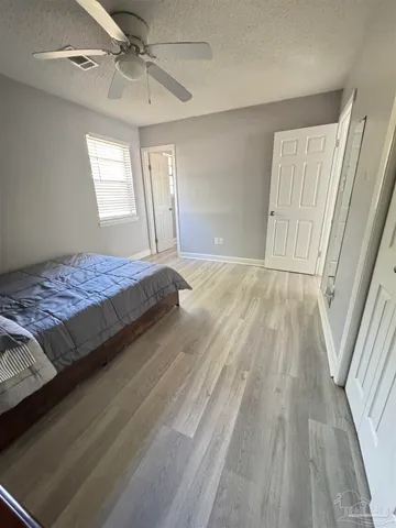 a bathroom with a toilet sink a mirror and shower