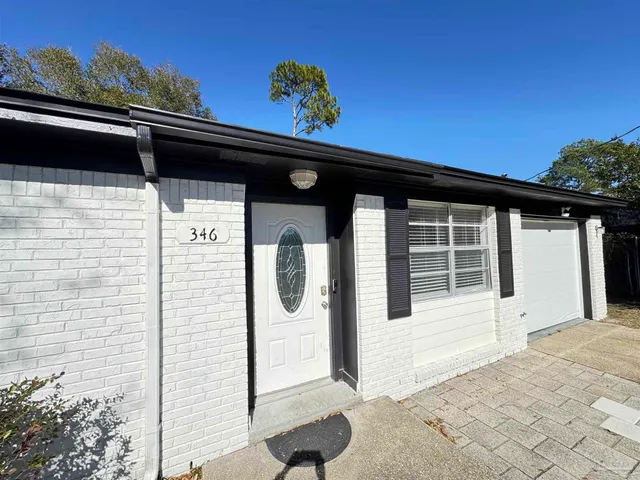 a front view of a house with a porch
