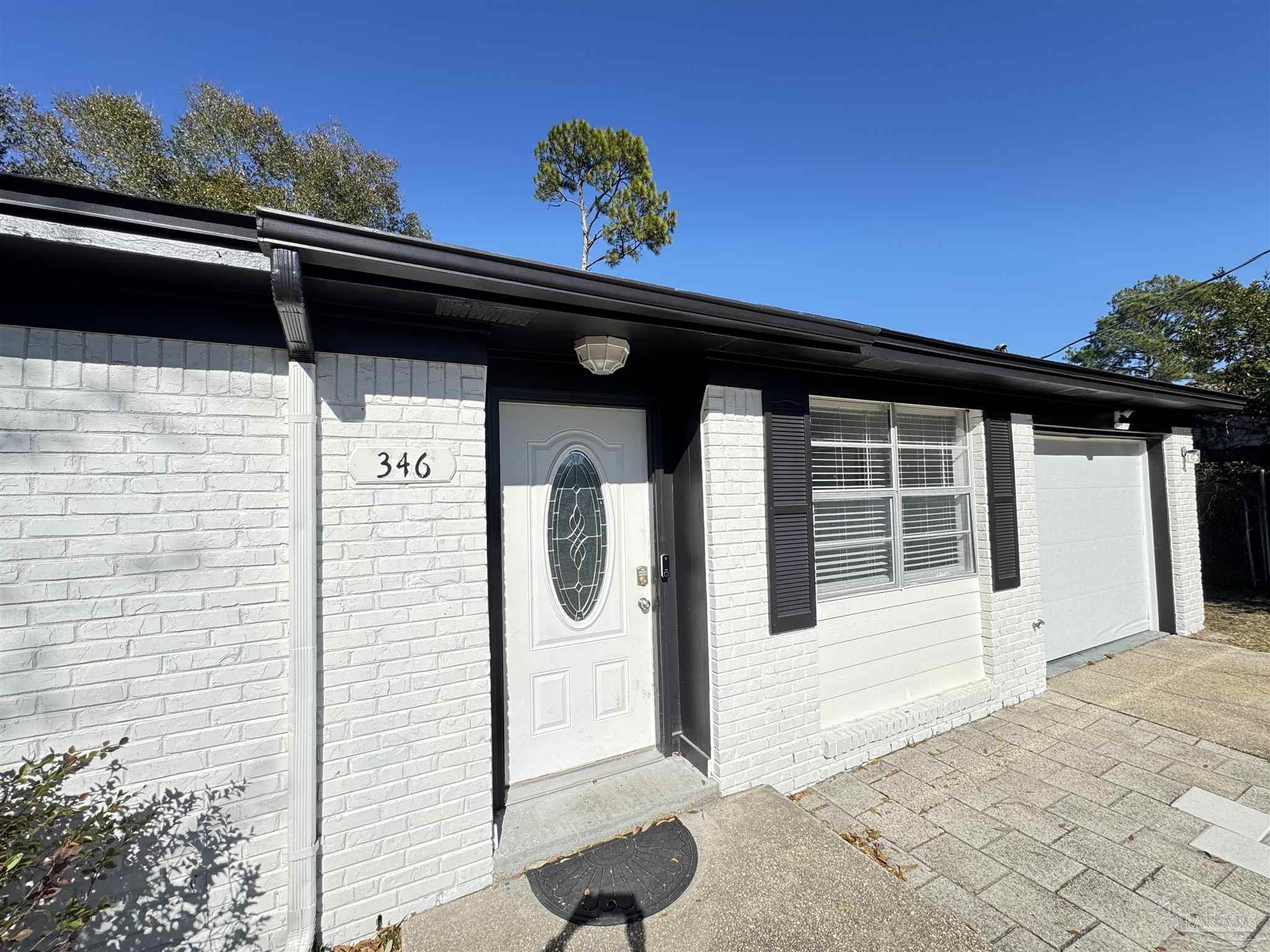 346 Quigley Road Pensacola, FL 32506 - Photo 2 of 28 a front view of a house with a porch