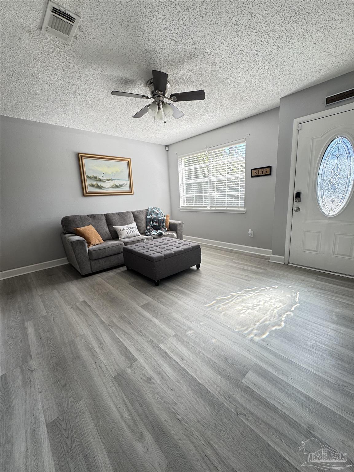346 Quigley Road Pensacola, FL 32506 - Photo 5 of 28 a living room with furniture and a window