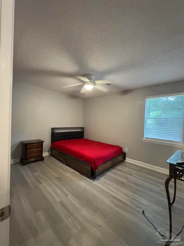 a room with a bed and a window