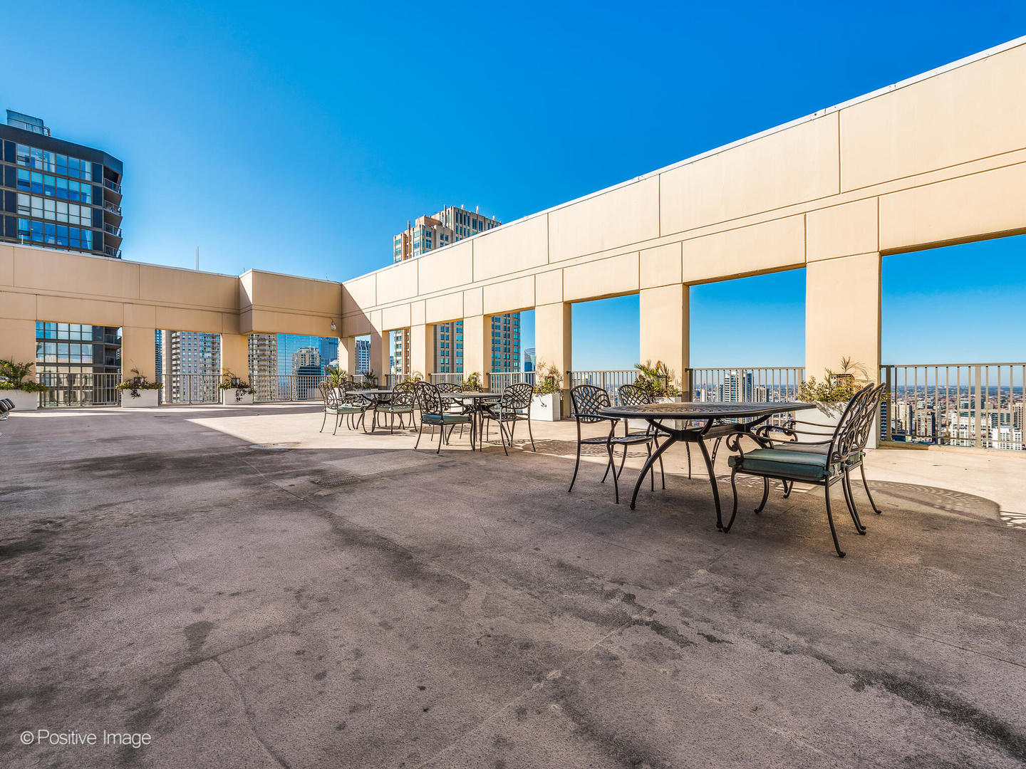 2 East Erie Street, Unit 3301 Chicago, IL 60611 - Photo 12 of 16 a view of a patio with dining table and chairs