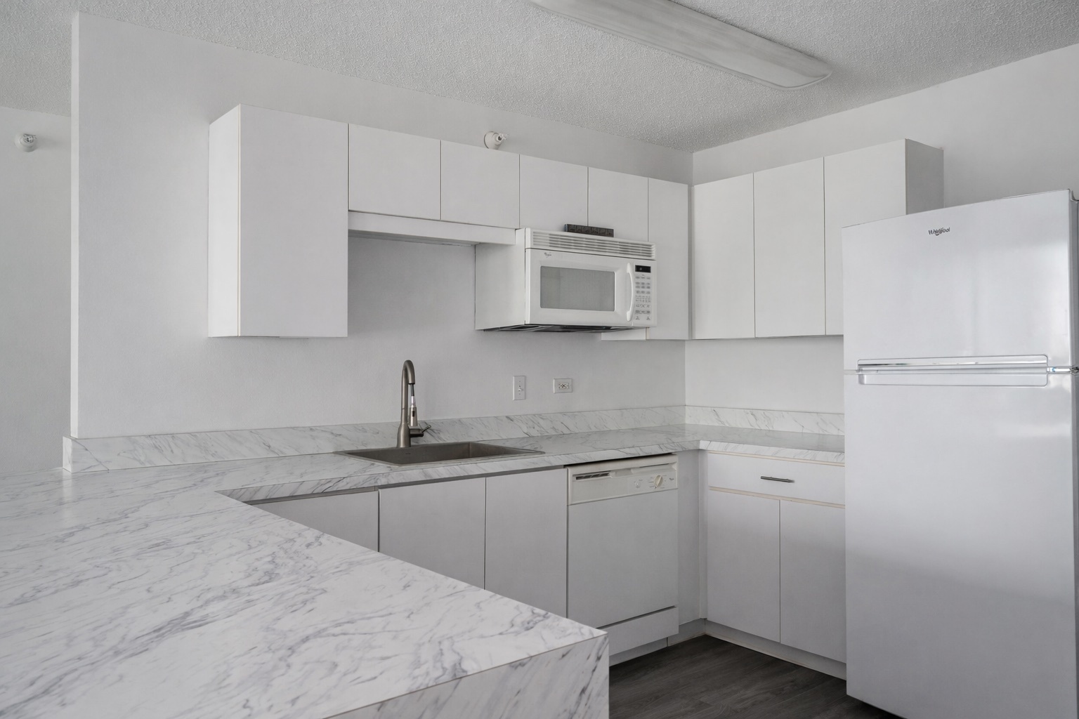 2 East Erie Street, Unit 3301 Chicago, IL 60611 - Photo 4 of 16 a kitchen with cabinets appliances and a sink
