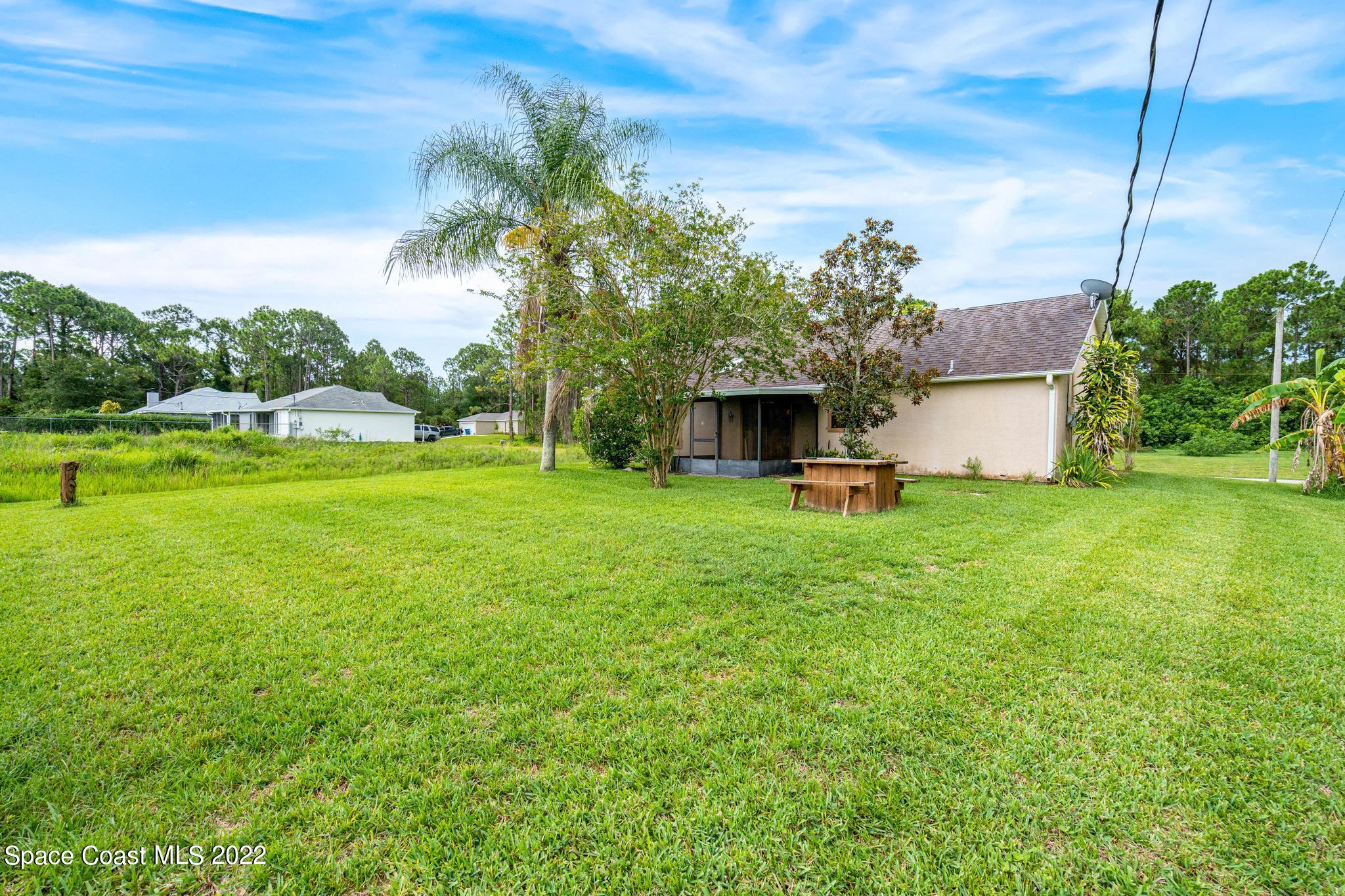 1355 Seabold Road Southwest Palm Bay, FL 32908 - Photo 13 of 22 a view of a house with a yard