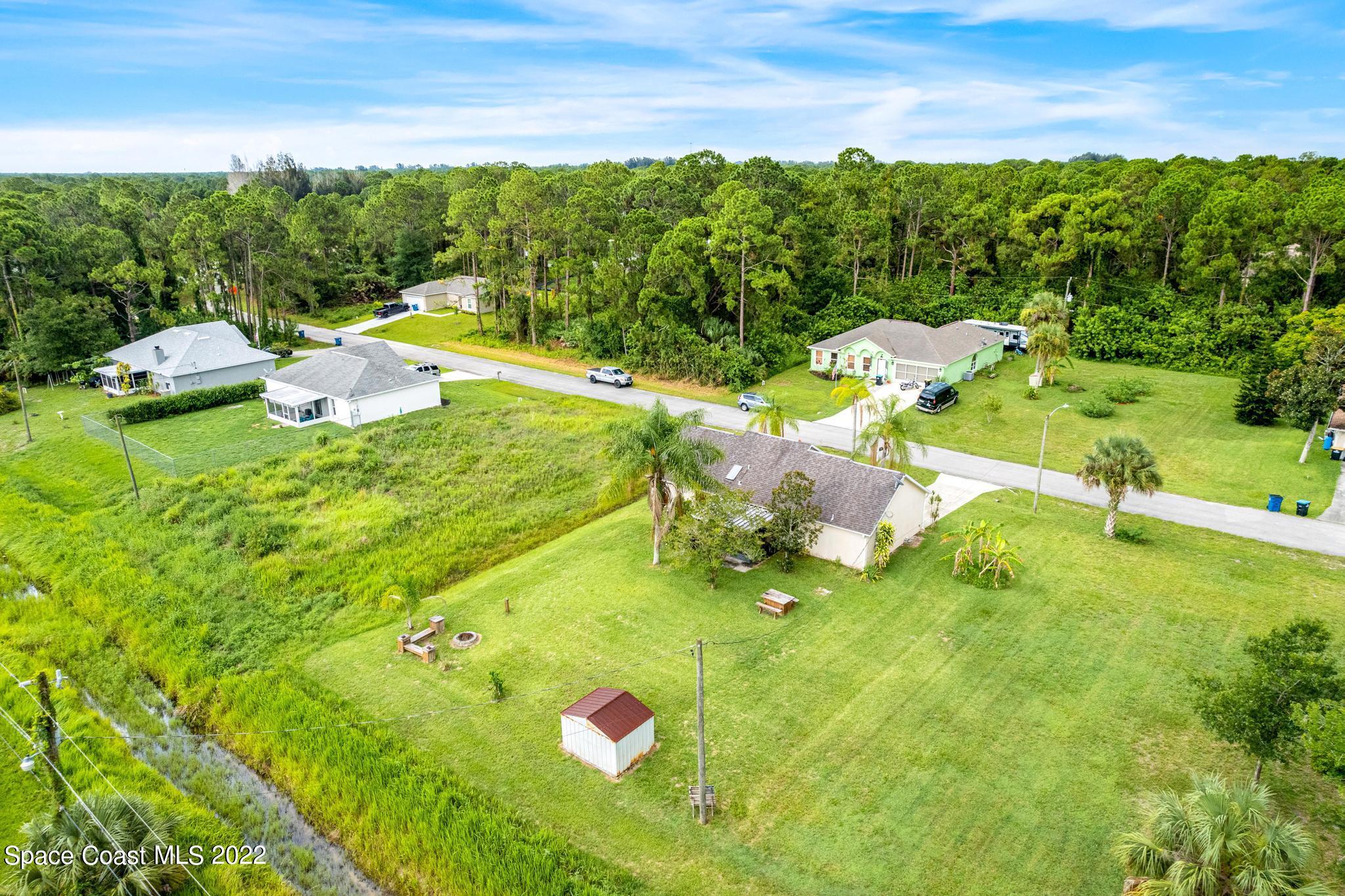 1355 Seabold Road Southwest Palm Bay, FL 32908 - Photo 17 of 22 a view of a golf course with chairs