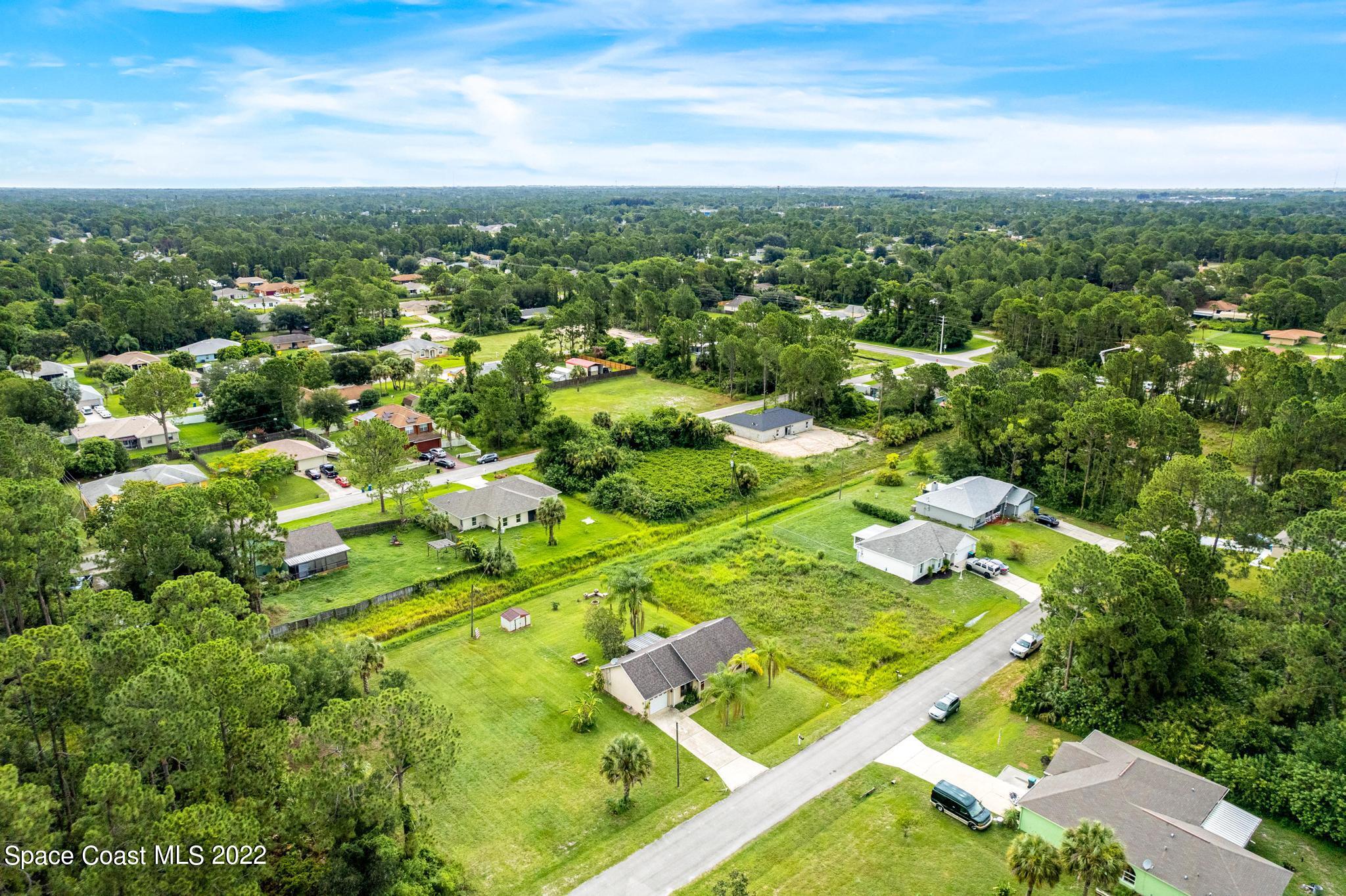 1355 Seabold Road Southwest Palm Bay, FL 32908 - Photo 18 of 22 an aerial view of residential houses with outdoor space