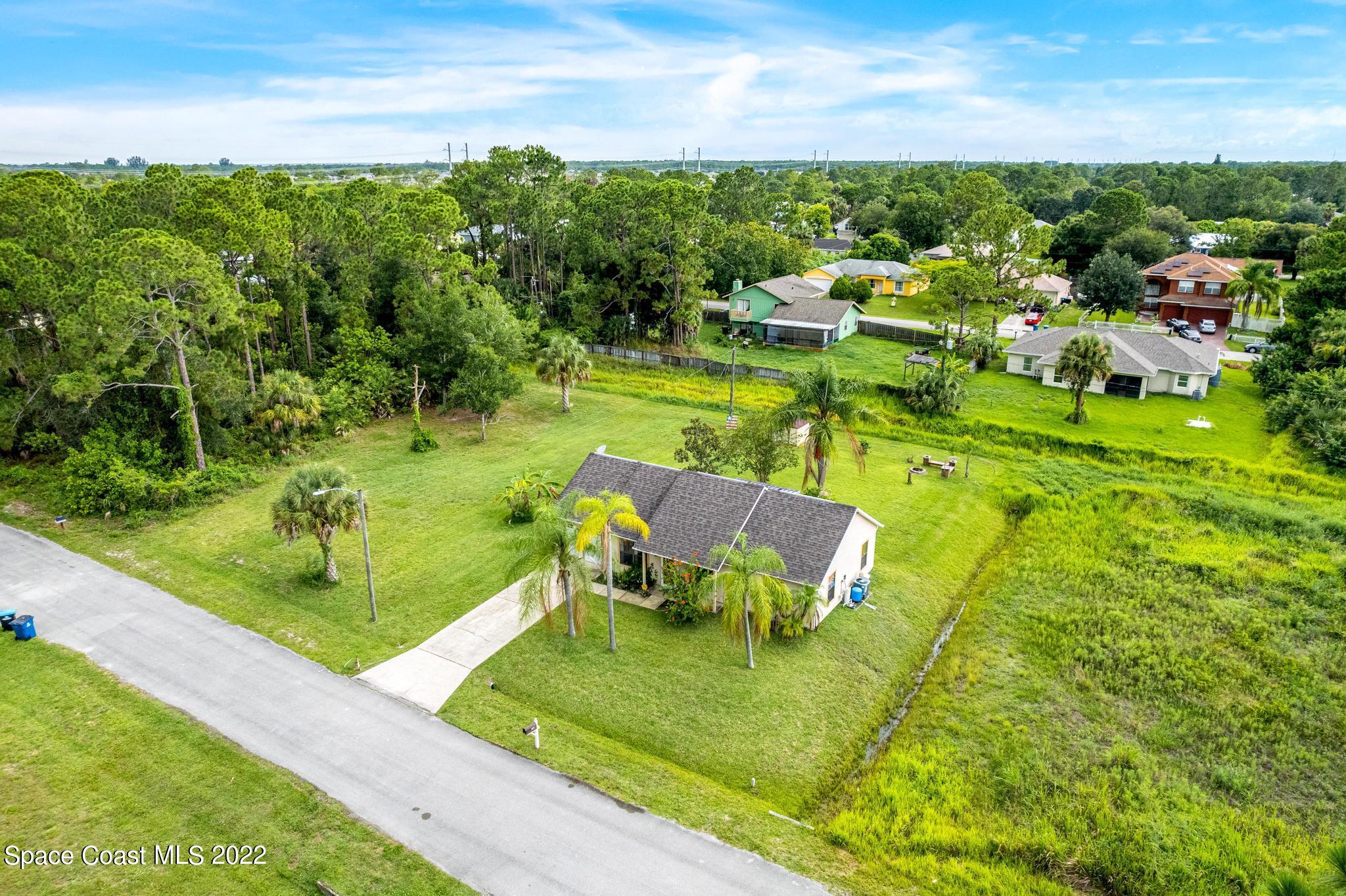 1355 Seabold Road Southwest Palm Bay, FL 32908 - Photo 19 of 22 a view of a golf course with chairs