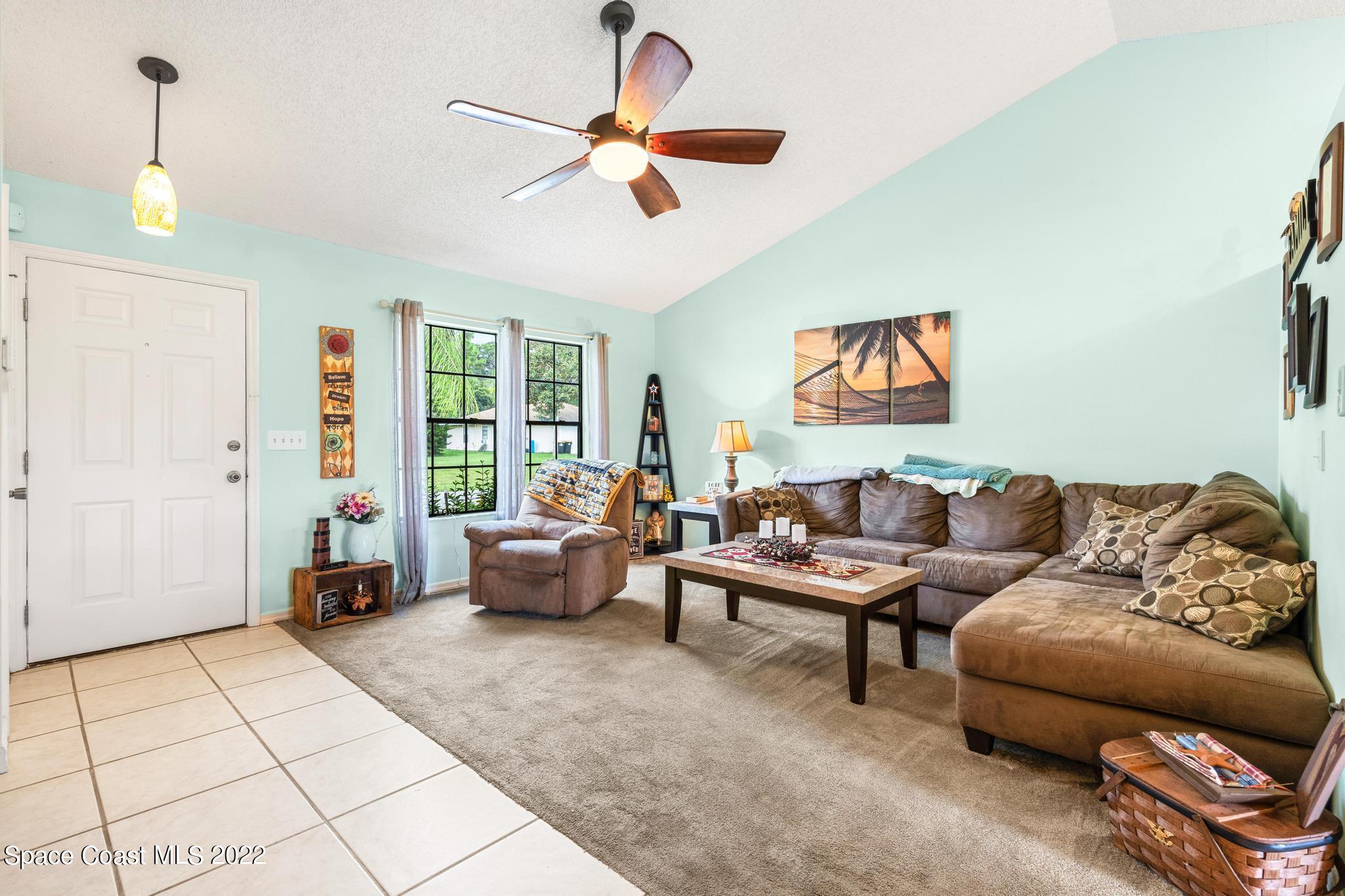 1355 Seabold Road Southwest Palm Bay, FL 32908 - Photo 2 of 22 a living room with furniture and a window