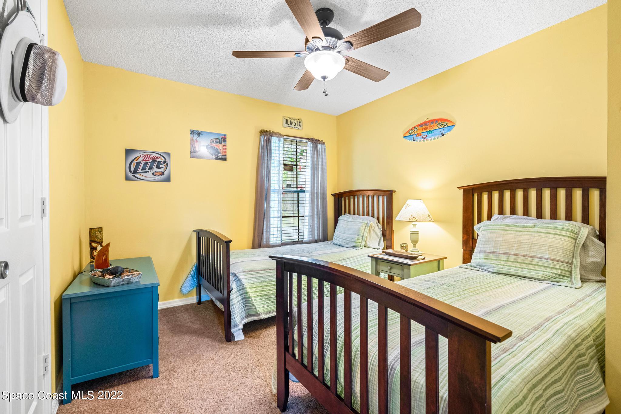 1355 Seabold Road Southwest Palm Bay, FL 32908 - Photo 10 of 22 a bedroom with a bed and a table
